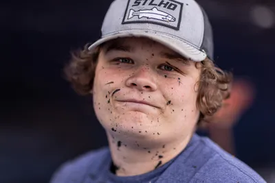 Jeff Kaluma is a young Quinault tribal fisherman applying bottom side paint to their dry-docked crab boat in preparation for the coming crab fishing season later in the fall, at Boat Haven Marina in Port Townsend, Washington, on July 24, 2023